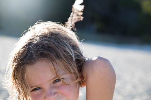 Boy with feather - Australian Stock Image