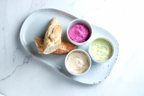 Bread on a ceramic dish with dips - Australian Stock Image