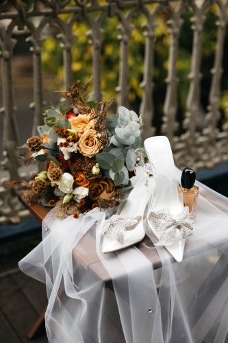 Bride accessories with shoes and bouquet - Australian Stock Image