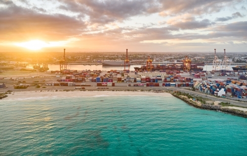 Bright sunlight shining through clouds over Fremantle Port.