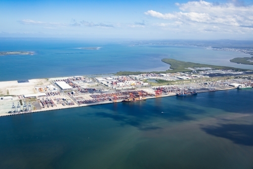 Brisbane River in foreground and Moreton Bay in background. Port of Brisbane facility middle. - Australian Stock Image