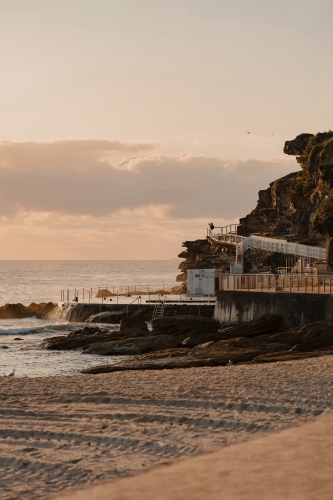 Bronte Beach ocean pool and headland at sunrise - Australian Stock Image