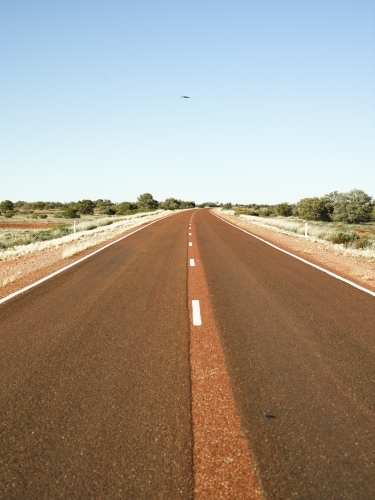 Brown bitumen highway in outback - Australian Stock Image