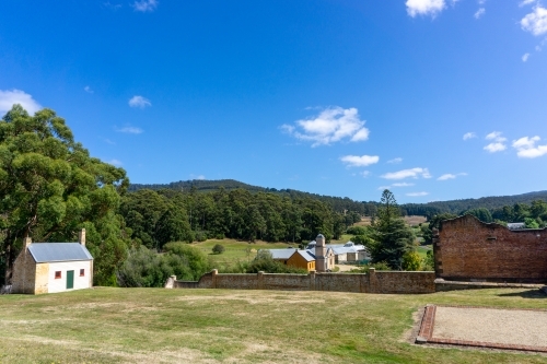 Buildings and grass at Port Arthur on a sunny day - Australian Stock Image