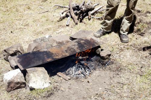 Bush barbeque over open fire - Australian Stock Image