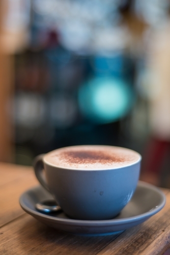 Cafe coffee on blue saucer - Australian Stock Image