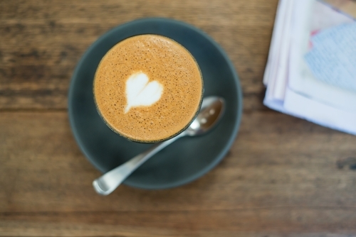 Cafe coffee on blue saucer - Australian Stock Image