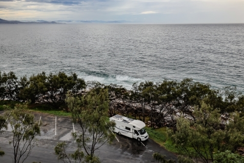 Camper van parked by the beach at Arakoon NSW - Australian Stock Image