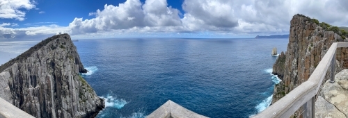 Cape Hauy Lookout panorama with handrail and view over ocean - Australian Stock Image
