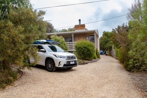 Car parked at beach house - Australian Stock Image