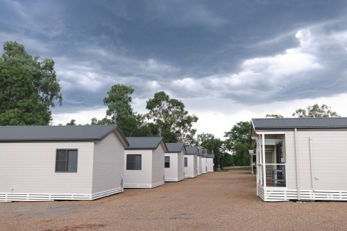 Caravan and cabin park on stormy day - Australian Stock Image
