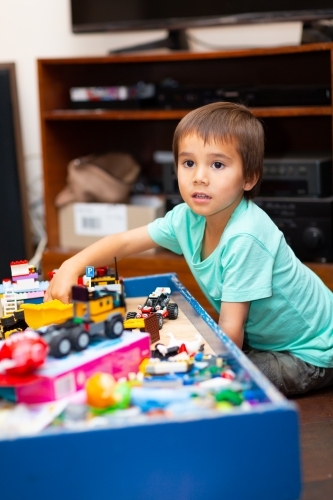 Child playing with toys at home