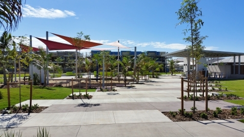 Children's play park and exercise park in suburban area with shade sails - Australian Stock Image