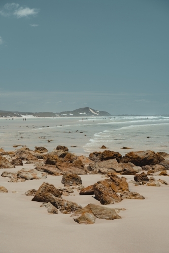 Clear ocean water and sand dunes at the beach near Mulgumpin Camping Area, North Point - Australian Stock Image