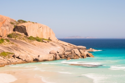 Clear waters with silky waves rolling in on the beach of Esperance. - Australian Stock Image