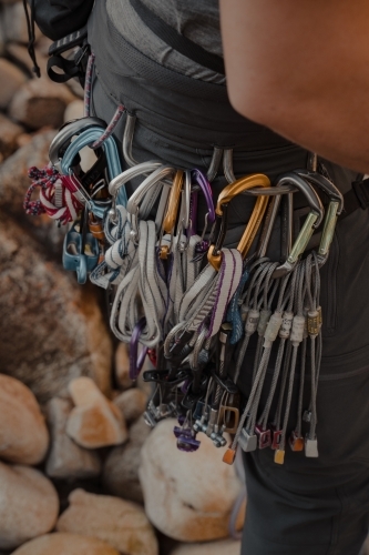 Climbing gear attached to a harness by carabiners - Australian Stock Image