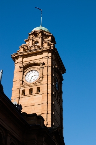 Clock tower against blue sky - Australian Stock Image
