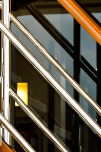 Close up abstract of part of a boat with diagonals and reflections - Australian Stock Image