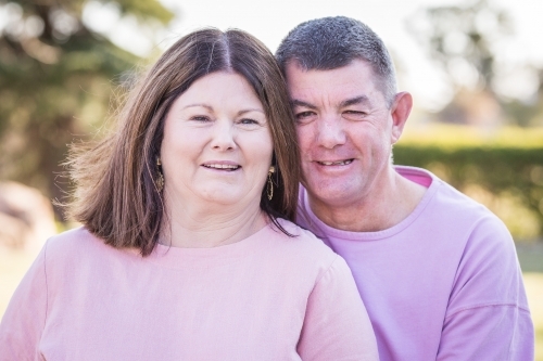 Close up husband and wife together smiling - Australian Stock Image