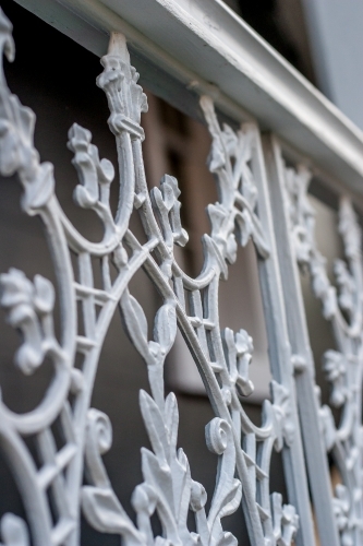 Close up of a decorative cast iron white verandah rail - Australian Stock Image