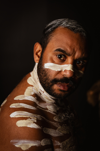Close-up of aboriginal man with white body paint - Australian Stock Image