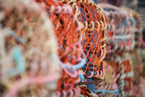 close up of cray pots on a wharf in a coastal town - Australian Stock Image