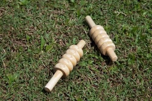 Close up of cricket bails lying on grass - Australian Stock Image