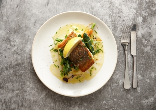 Close up of delicious barramundi dish on plate - Australian Stock Image