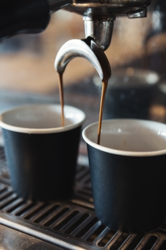 Close up of espresso machine making coffee in a cafe - Australian Stock Image