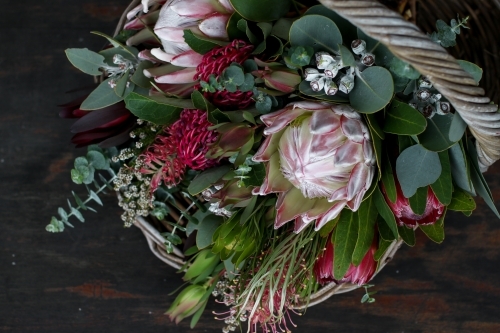 Close up of native floral arrangement in a wicker basket - Australian Stock Image