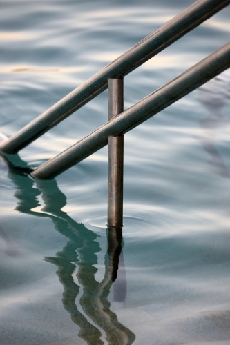 Close-up of sea pool and railings on dusk - Australian Stock Image