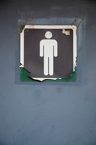 Close up of signs on public restroom toilet doors - Men's - Australian Stock Image