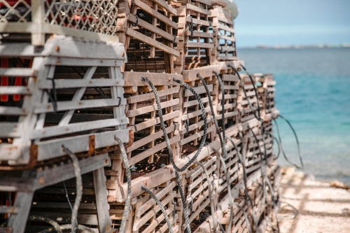 Close-up of stack of wooden craypots for commercial crayfishing - Australian Stock Image