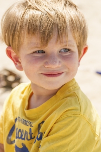 Close up of toddler boy at the beach