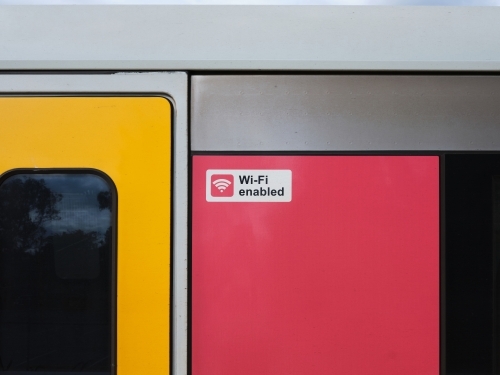 Close-up of train carriage with "Wi-Fi enabled" sign - Australian Stock Image