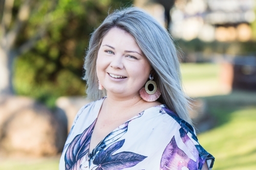 Close up of young woman in early 20s smiling - Australian Stock Image