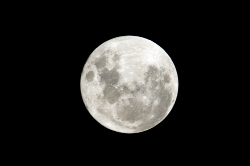 Close up shot of a full moon with visible craters - Australian Stock Image