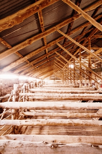 Close up shot of an old fashioned shearing shed with multiple wooden materials to create a divider - Australian Stock Image