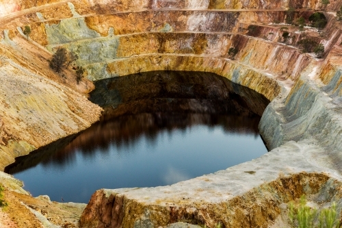 Close up shot of an open cut mining with rusty environment - Australian Stock Image