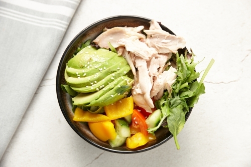 close up shot of chicken avocado salad - Australian Stock Image
