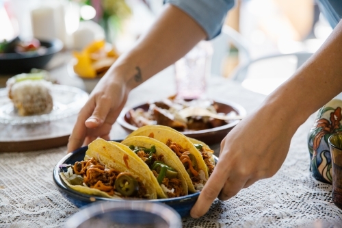 Close up shot of tacos served in a table - Australian Stock Image