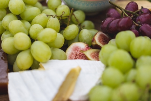 Closeup of cheese and fruit - Australian Stock Image