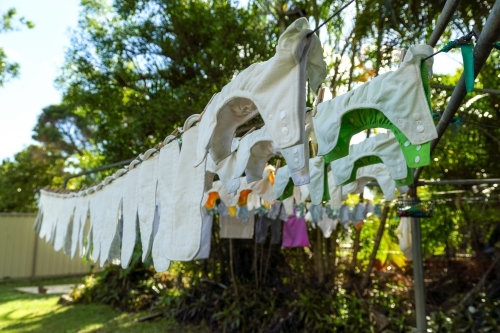 Cloth nappies hanging on clothes line. - Australian Stock Image