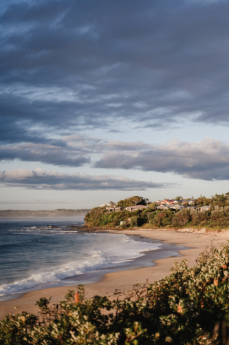 coastline view to houses on clifftop - Australian Stock Image