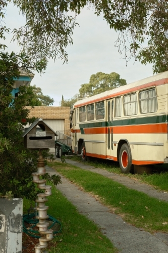 Colourful bus in urban driveway - Australian Stock Image