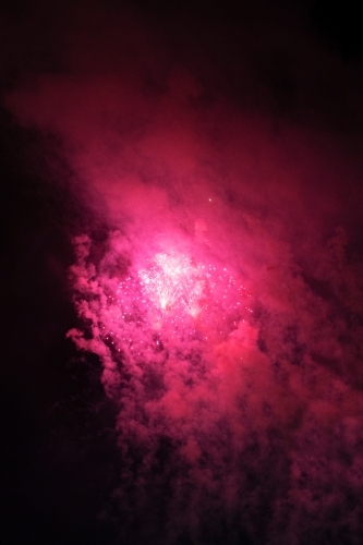 Colourful fireworks display in sky at night - Australian Stock Image