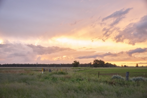 Colourful sunset over farmland - Australian Stock Image