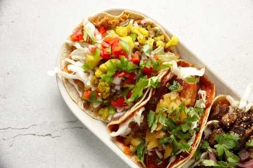 Colourful variety of meat tortillas on plate - Australian Stock Image