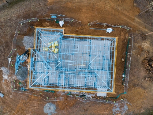 Concrete slab & metal framework of residential house under construction - Australian Stock Image