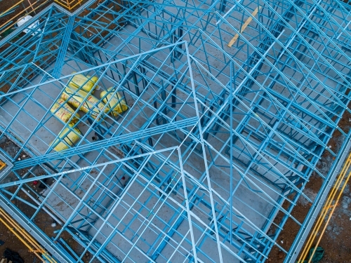 Concrete slab & metal framework of residential house under construction - Australian Stock Image